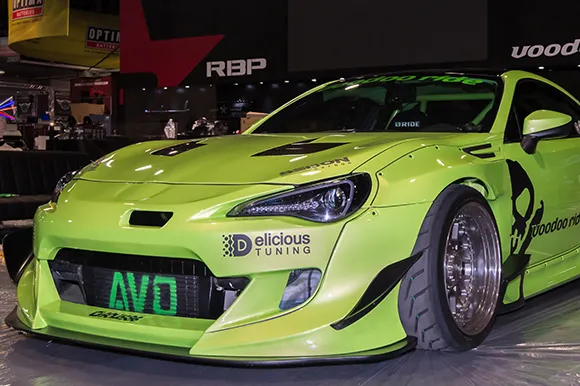 A customized green Scion FR-S on display at the Specialty Equipment Market Association event.