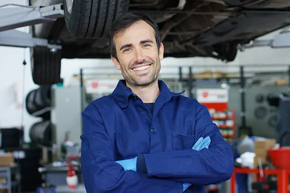 A car mechanic in an auto repair shop